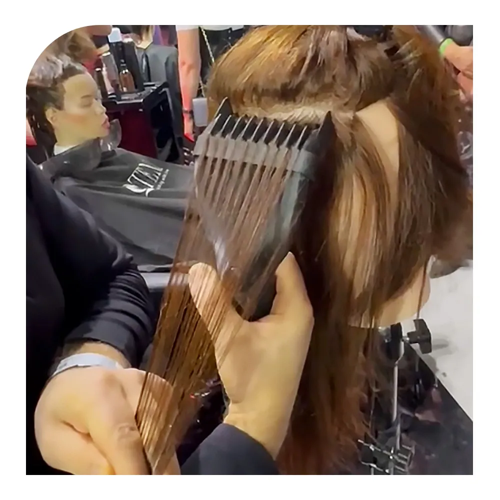 Colourist separating a strand with the Napitel Diamond handle